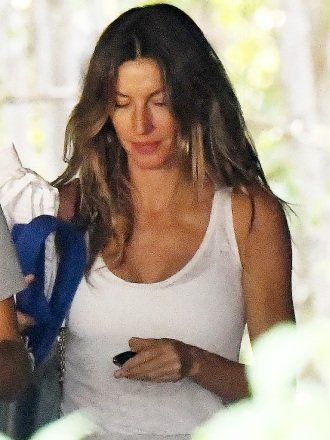 EXCLUSIVE: Gisele Bundchen drops her wedding ring as she takes her two children to a Miami gym amid reports that she and husband Tom Brady are on the way to a divorce.  Wearing a white top and gray sweats, the 42-year-old Brazilian beauty looked dejected as she went to a workout with 12-year-old Benjamin and nine-year-old Vivian.  The Victoria's Secret model is said to have stayed with friends in Miami, while star quarterback Brady, 45, is back training with his Buccaneers teammates in Tampa after Hurricane Ian devastated Florida's west coast.  Both are said to have hired divorce lawyers and 