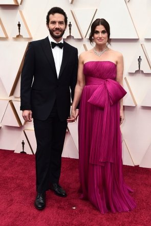 Aaron Lohr and Idina Menzel.  Aaron Lohr, left, and Idina Menzel arrive at the Oscars at the Dolby Theater in Los Angeles 92nd Academy Awards - Arrivals, Los Angeles, U.S. - February 09, 2020