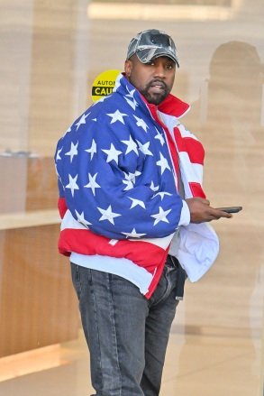 Kanye West goes to a meeting in Sherman Oaks after church.  Kanye wore an oversized American flag bomber jacket.  November 27, 2022 Pictured: Kanye West.  Credit: @CelebCandidly/Snorlax/MEGA TheMegaAgency.com +1 888 505 6342 (Mega Agency TagID: MEGA921309_001.jpg) [Photo via Mega Agency]