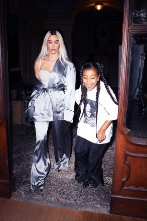 MILAN, ITALY - *EXCLUSIVE* - Kim Kardashian and daughter North West take off from the set of a photo shoot in Milan.  Kim rocks an off the shoulder look while donning a satin bathrobe for the occasion.  Pictured: Kim Kardashian, North West BACKGRID USA 27 SEPTEMBER 2022 BYLINE MUST READ: @Lucasgro / BACKGRID USA: +1 310 798 9111 / usasales@backgrid.com UK: +44 208 344 2007 / uksales@backgrid.com *UK Clients - Please pixelate the face of images with children before publication*