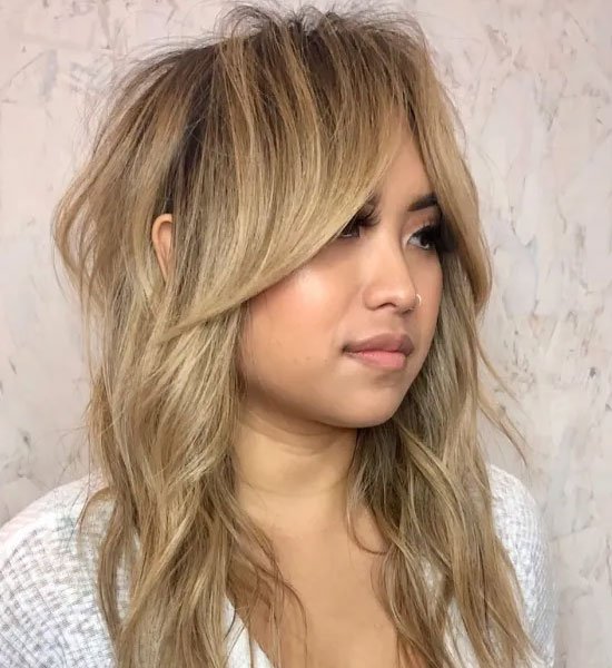 Honey Blonde Wolf Haircut with Bangs 