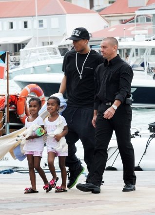 Kim Porter and her children arrive in Gustavia from their huge yacht to go to St Jean beach.  The Diddy family posed and waved as they arrived at the port in their inflatable boat.  Kim was dressed in a very colorful moo-moo dress.  Kim Porter was traveling with sons Quincy and Christian and their twin daughters Lila Star and Jessie James Combs.  Pictured: Kim Porter with children Quincy, Christian and twins Lila Star and Jessie James Combs., Kim Porter with children Quincy Christian, twins Lila Star Jessie James Combs.  Ref: SPL237026 301210 NON-EXCLUSIVE Image from: SplashNews.com Splash News and Pictures Los Angeles: 310-821-2666 New York: 212-619-2666 London: 0207 644 7656 Milan: 02 4399 8577 photodesk@splashnews.com World Rights