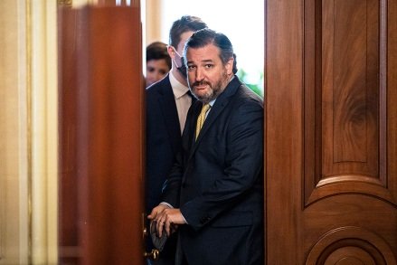 Senator Ted Cruz, R-Texas, exits a briefing room for former President Donald Trump's attorneys on the Capitol and returns through the Senate reception room to Senate Hill, on the fourth day of the Senate impeachment trial for former President Donald Trump, Friday, February 12, 2021 Washington.  (Jabin Botsford/The Washington Post via AP, Pool)