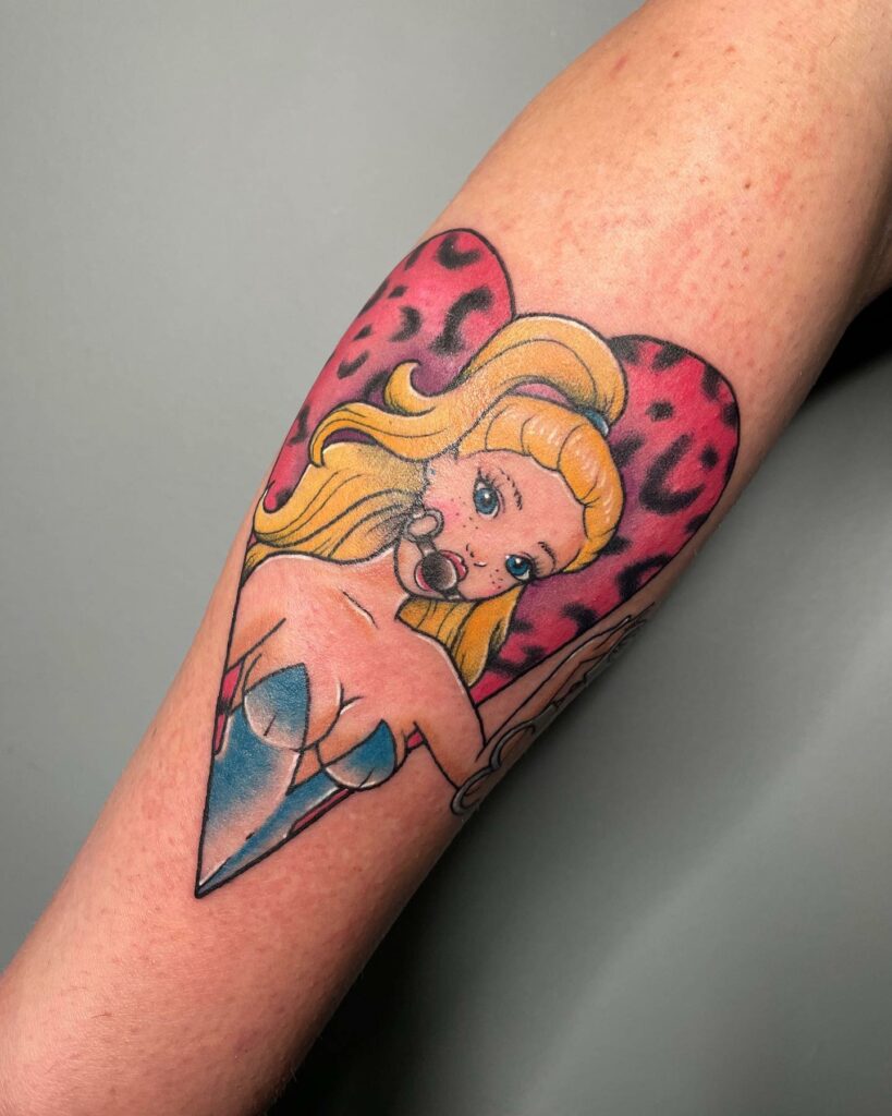 Watercolor Barbie tattoo design on the forearm