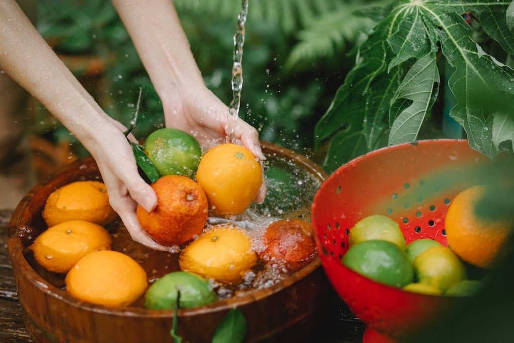 woman washing fruit